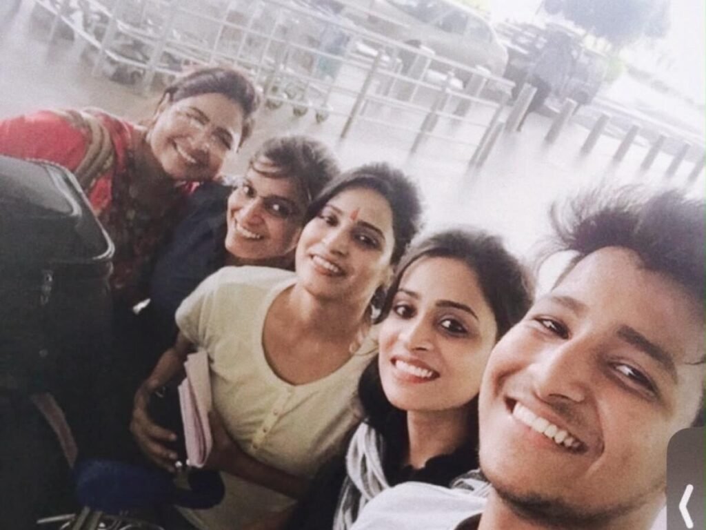 Nandini (center) with her mother (far left) and siblings before leaving for the US.