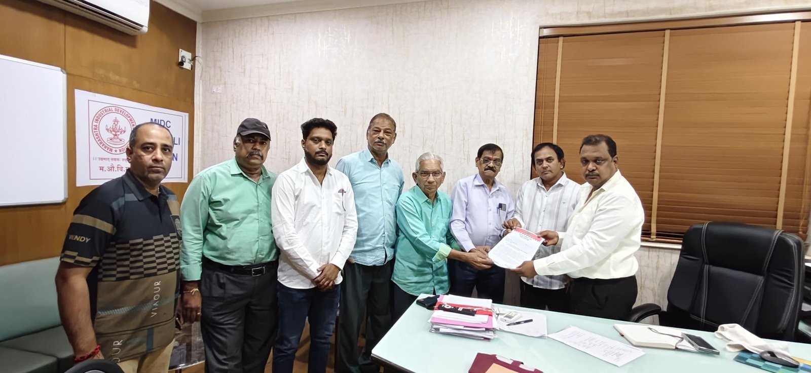 Milapnagar residents with MIDC officials at the MIDC office in Dombivli