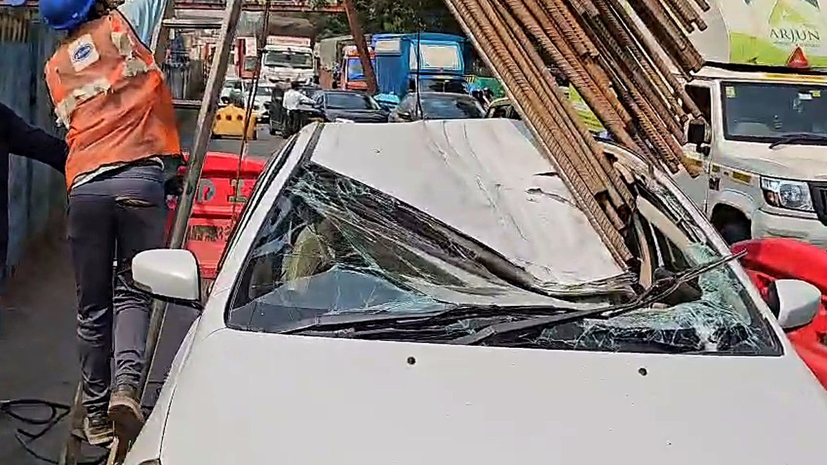 Iron reinforcement cage toppled onto a car with a shattered windshield on Kopri Bridge, Thane