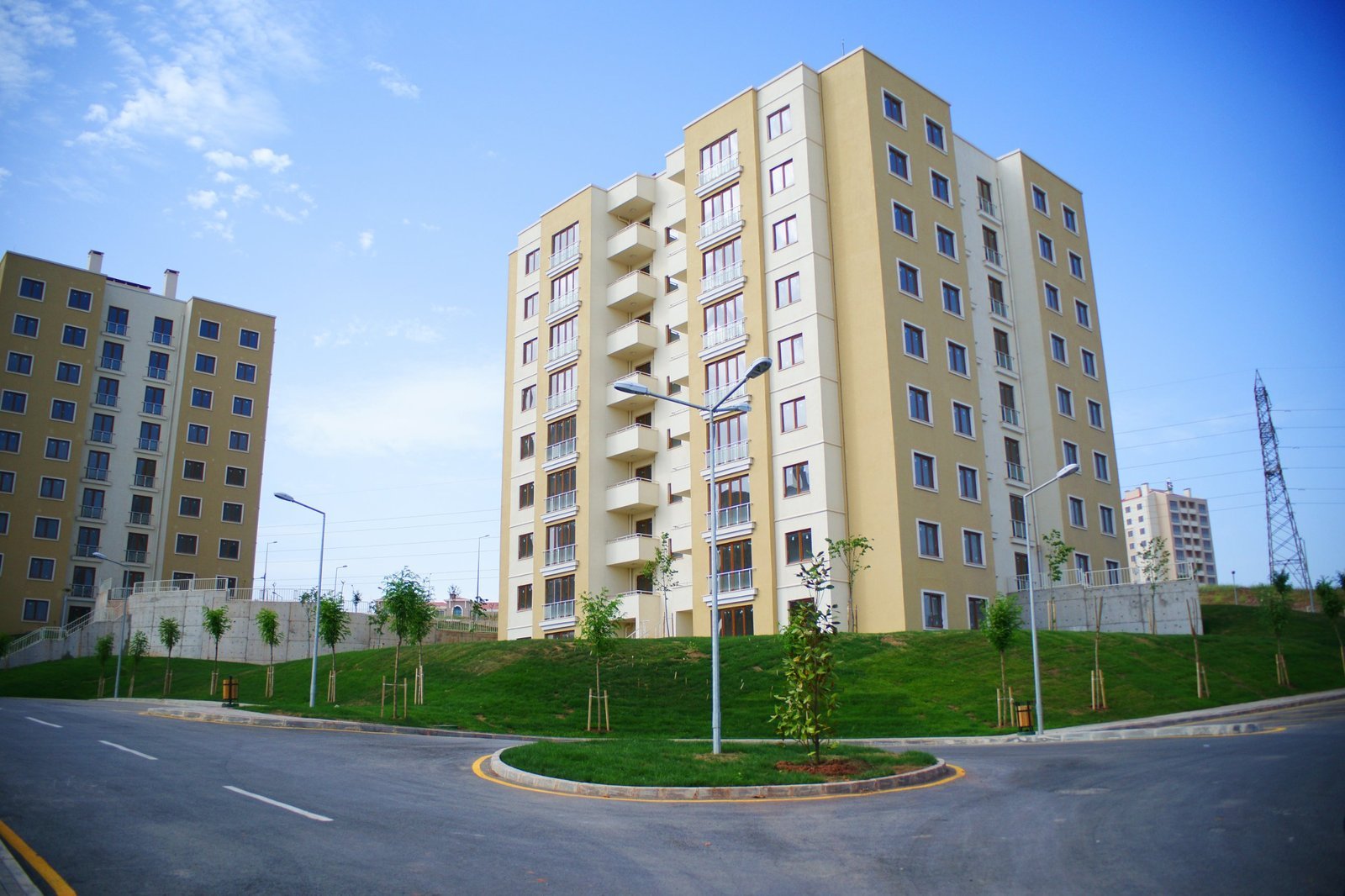 Residential towers beside a road, representing MHADA housing for mill workers
